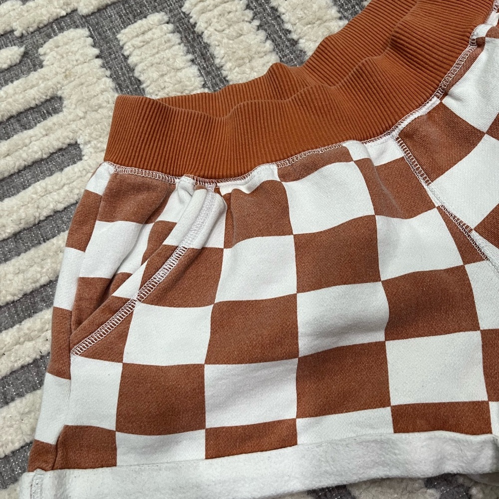 Out from under checkered shorts - Picture 2 of 11